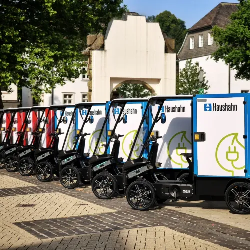 Fleet of eCargo Bikes branded with Schindler standing in row