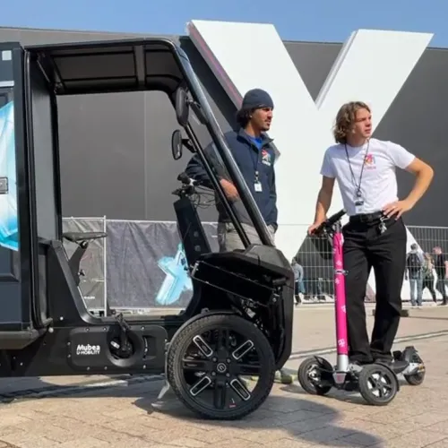 Electric cargo bike at the DIGITAL X event with two staff members outdoors