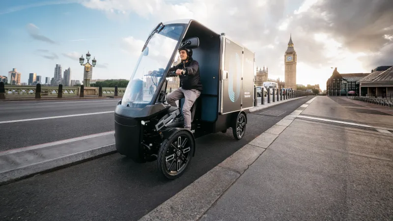 Electric cargo vehicle on Westminster Bridge with Big Ben in the background